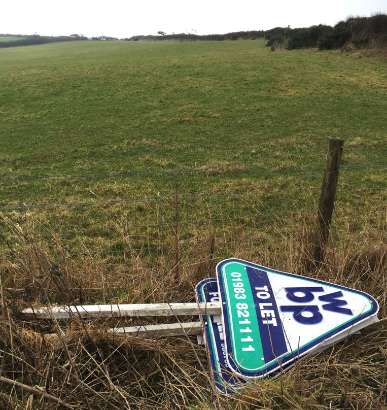 Who would drive nearly a mile from the nearest village, up a steep and rough track, to dump these signs in our countryside?