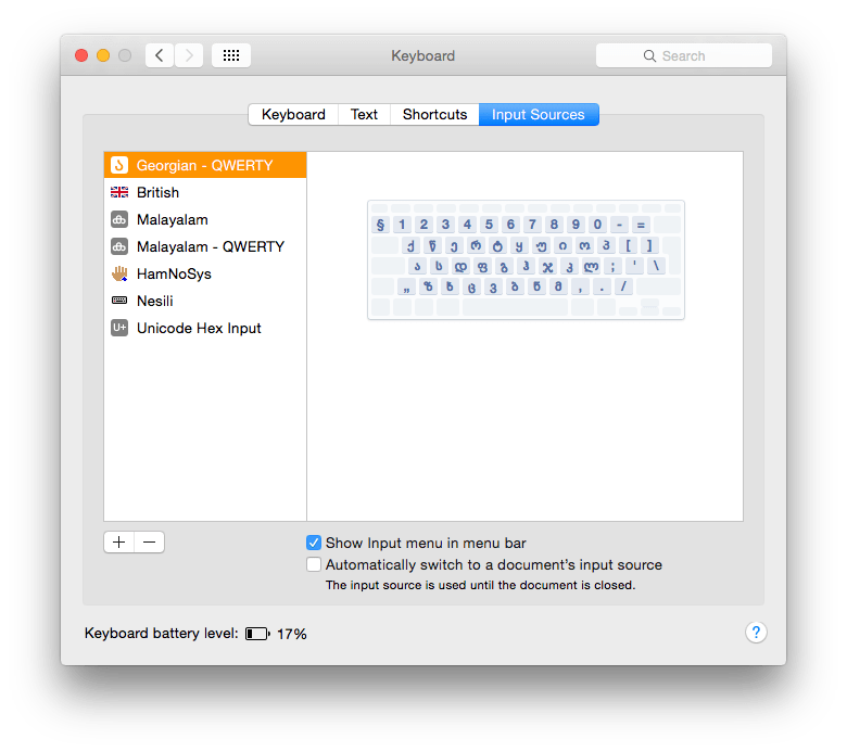 The Input Sources tab in Keyboard sets up those keyboard layouts to be accessed through the menu.